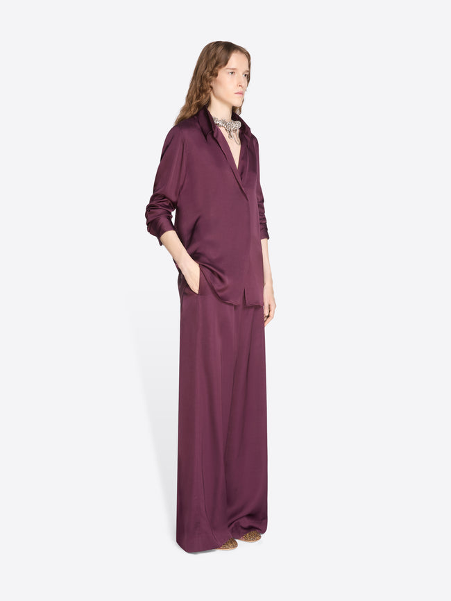 Woman wearing a long burgundy dress on a white background - Dries Van Noten