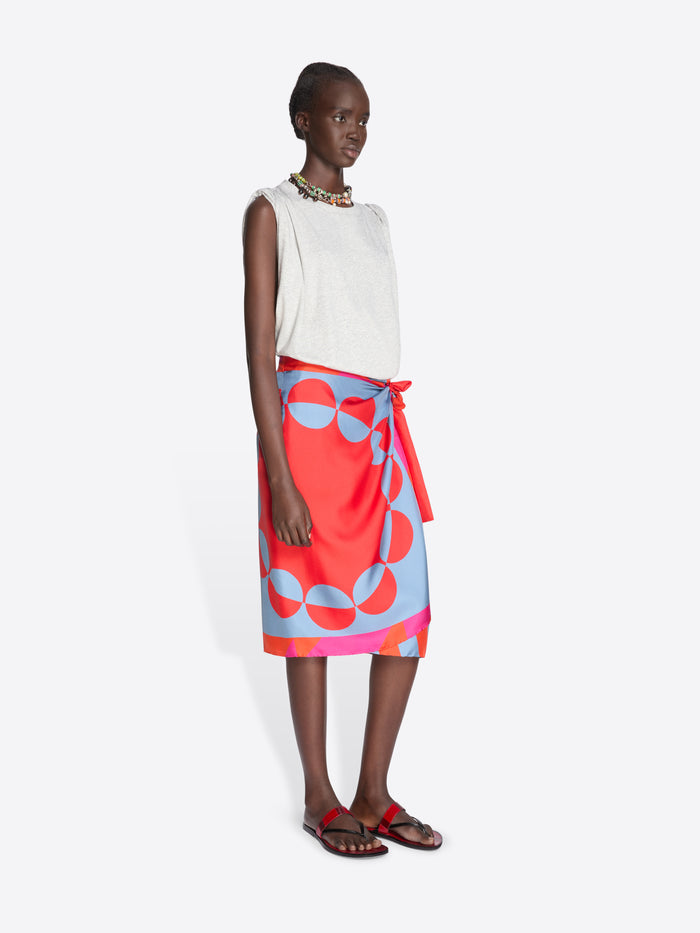 Woman wearing a grey sleeveless top and colorful skirt on a white background - Dries Van Noten