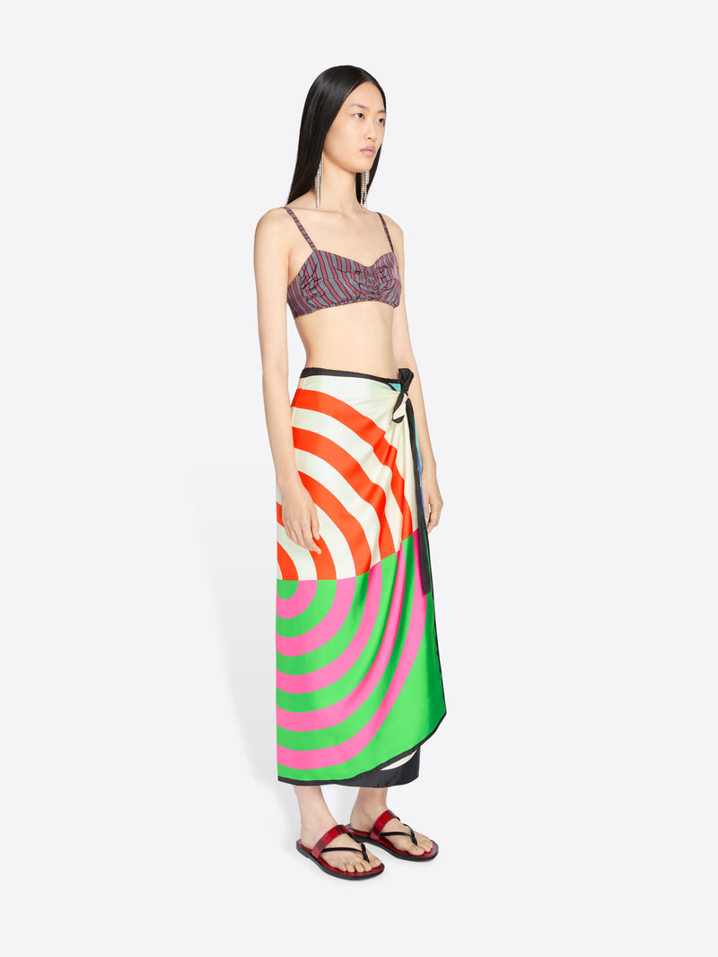 Woman wearing a colorful skirt with a white background - Dries Van Noten