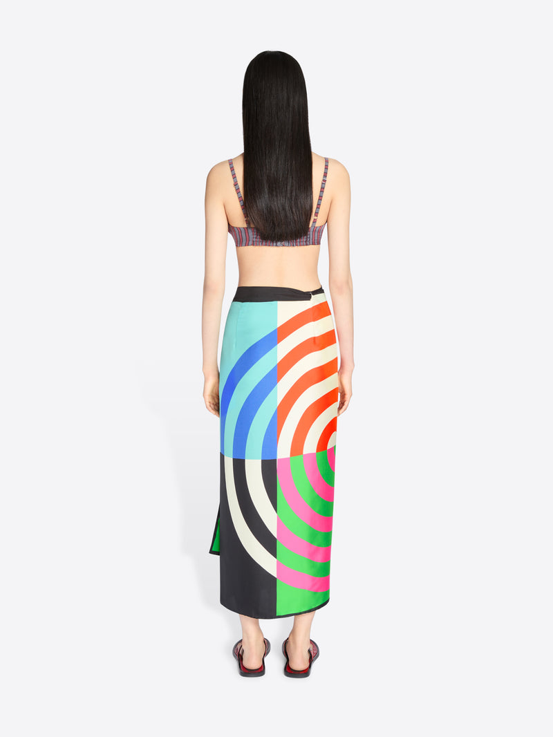 Woman wearing a colorful skirt with a white background - Dries Van Noten