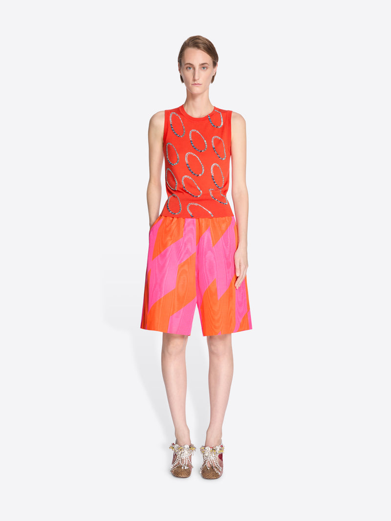 Model wearing a colorful set with abstract patterns on a white background - Dries Van Noten