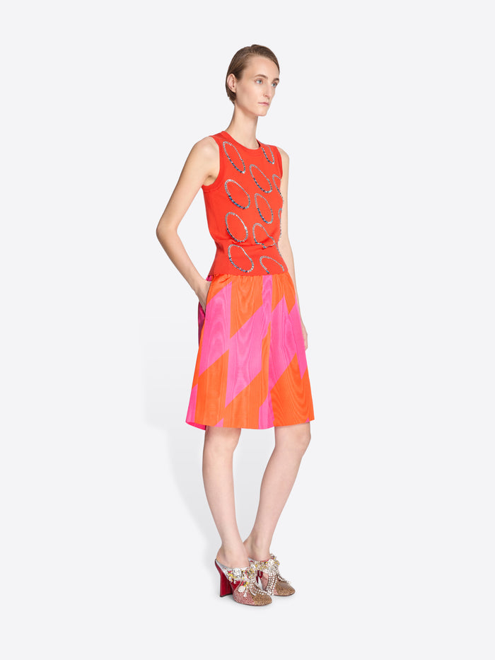 Model wearing a colorful set with abstract patterns on a white background - Dries Van Noten