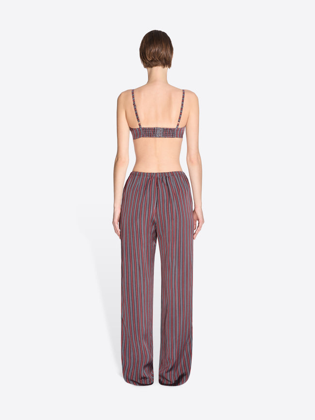 Woman wearing a striped outfit on a white background - Dries Van Noten