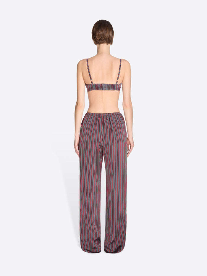 Woman wearing a striped outfit on a white background - Dries Van Noten