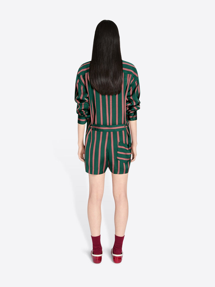 Person wearing a green and pink striped outfit on a white background - Dries Van Noten