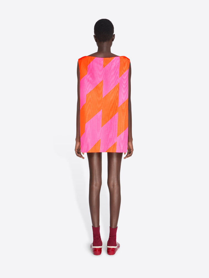 Person wearing a vibrant, geometric-patterned dress on a white background - Dries Van Noten