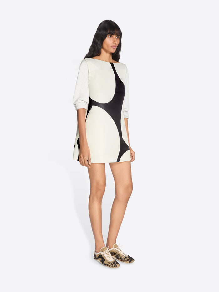 Woman wearing a black and white patterned dress on a white background - Dries Van Noten