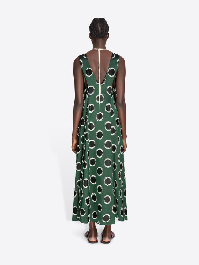 Woman wearing a green dress with black pattern on a white background - Dries Van Noten