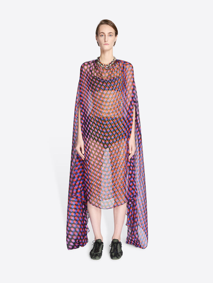 Model wearing a colorful geometric patterned dress on a white background - Dries Van Noten
