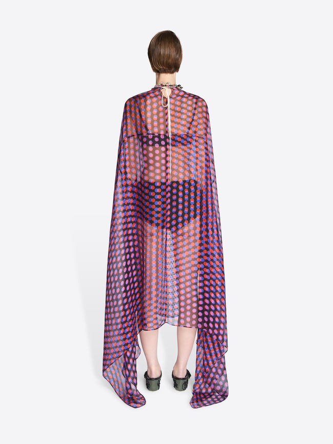 Person wearing a sheer, patterned garment on a white background - Dries Van Noten