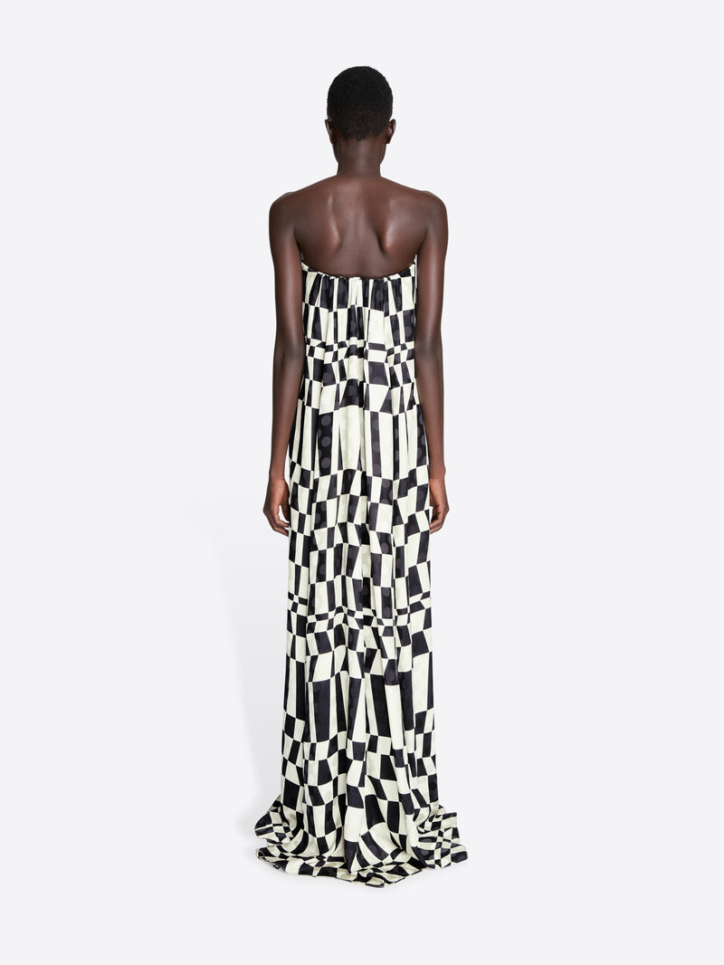 Woman wearing a black and white checkered strapless gown on a white background - Dries Van Noten