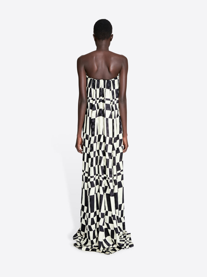 Woman wearing a black and white checkered strapless gown on a white background - Dries Van Noten