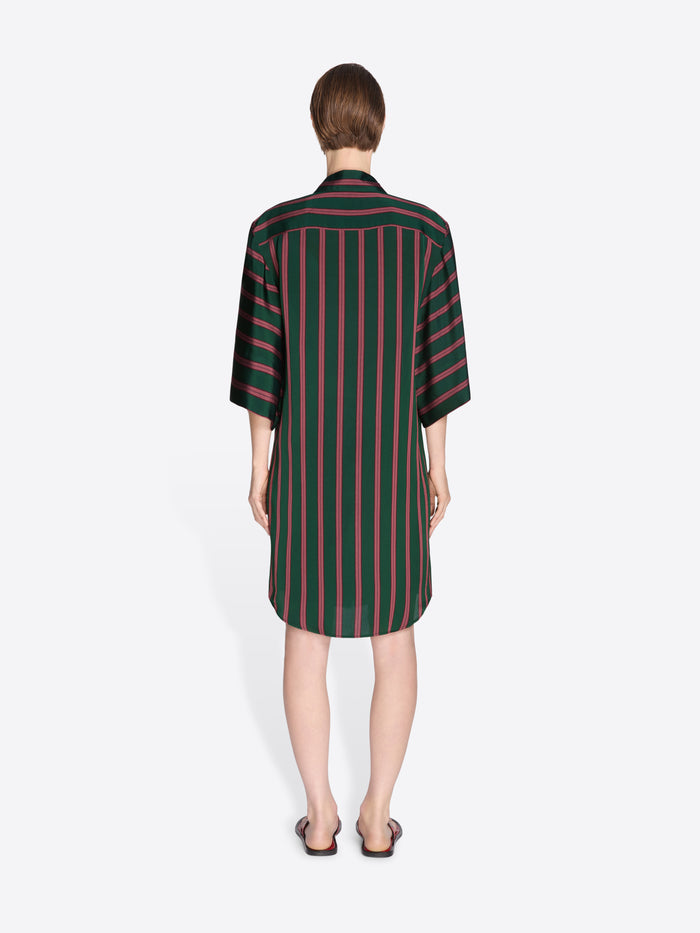 Woman wearing a green and red striped dress on a white background - Dries Van Noten