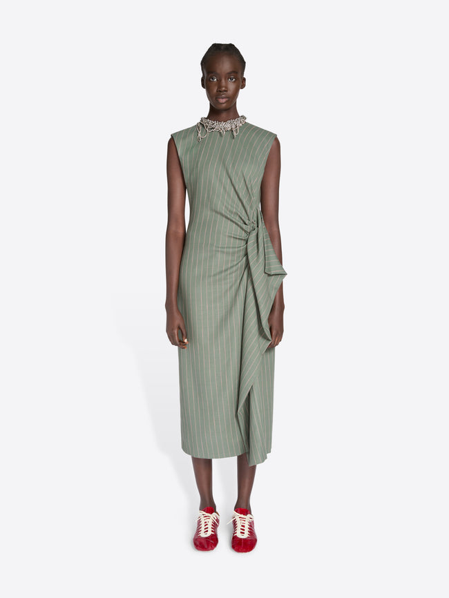 Model wearing a green dress with a white background - Dries Van Noten
