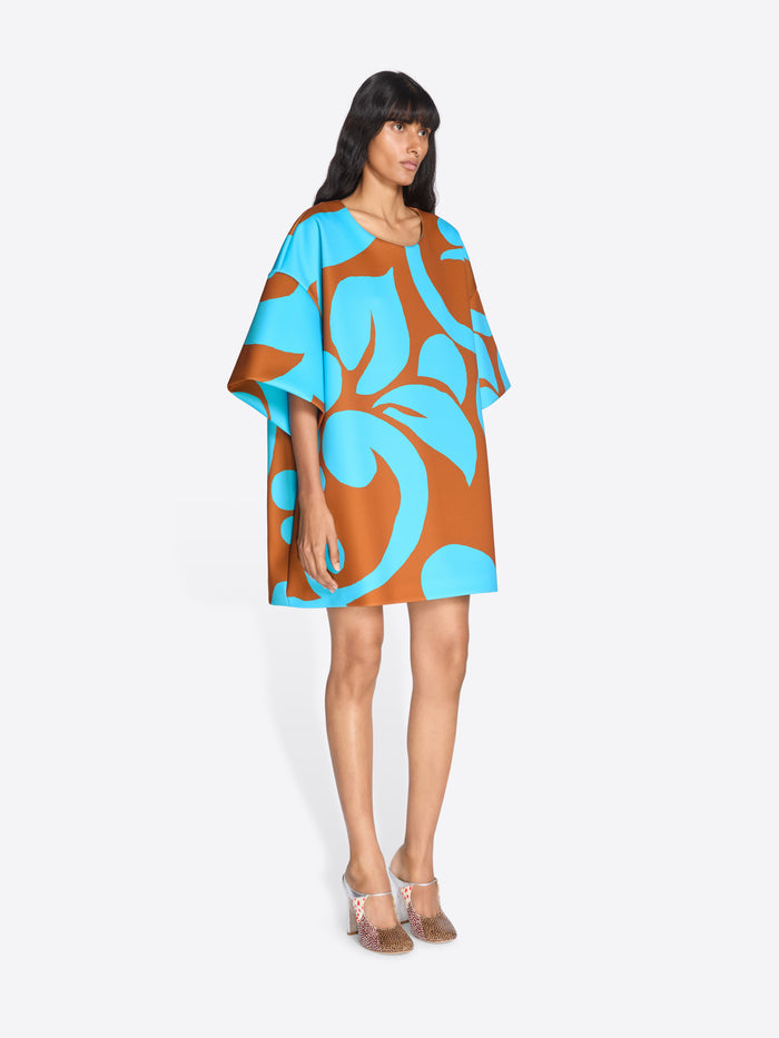 Woman wearing a brown and blue patterned dress on a white background - Dries Van Noten