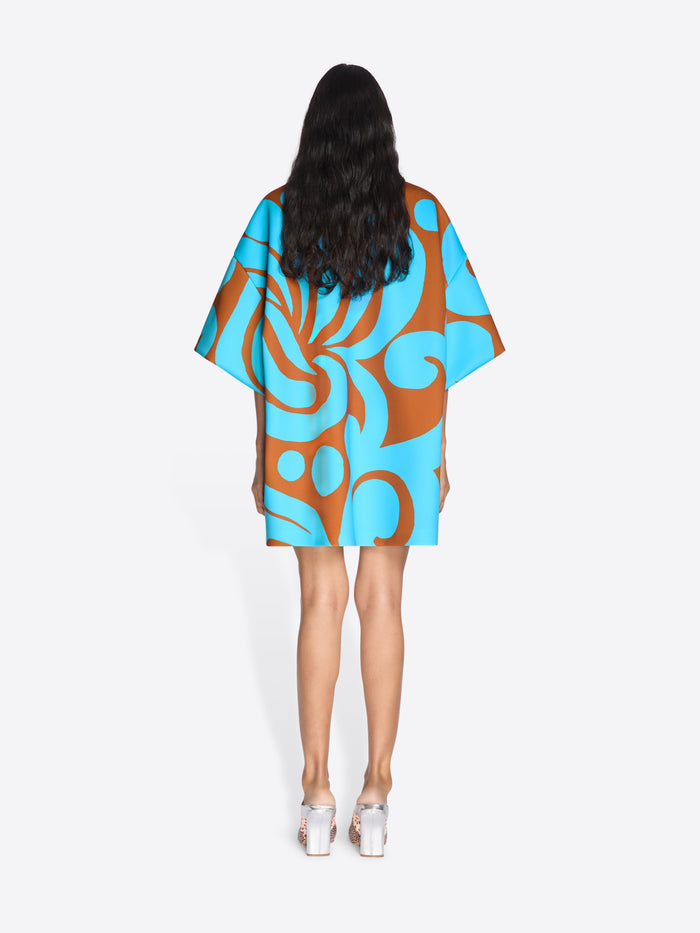 Woman wearing a blue and brown patterned dress on a white background - Dries Van Noten