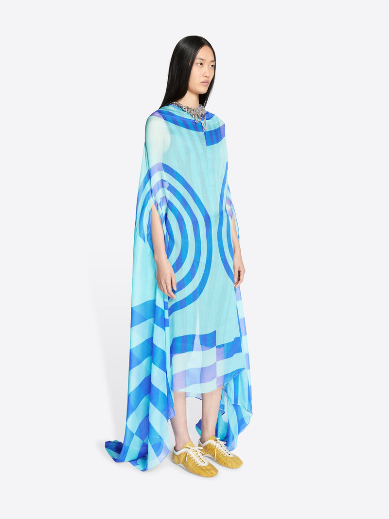 Model wearing a blue and white patterned dress on a white background - Dries Van Noten
