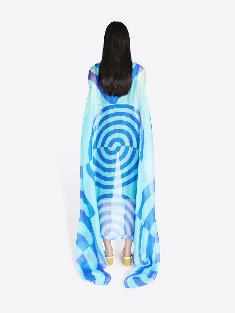 Person wearing a blue and white patterned dress on a white background - Dries Van Noten