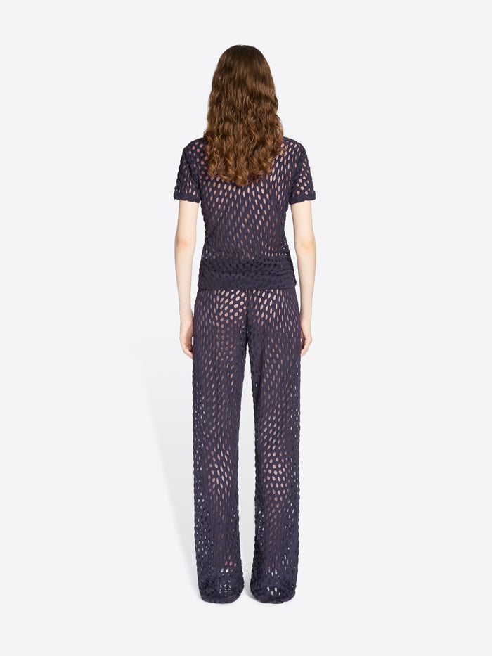 Woman wearing a dark purple textured outfit on a white background - Dries Van Noten