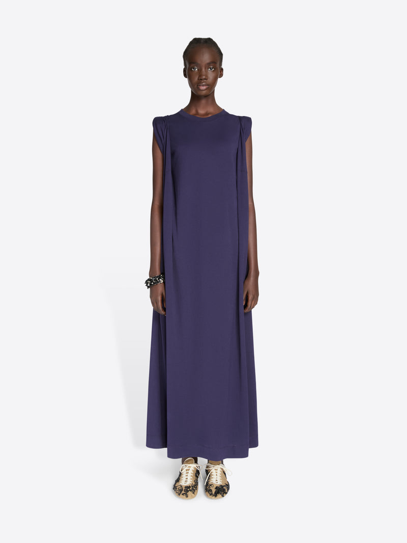 Model wearing a long dark blue dress on a white background - Dries Van Noten