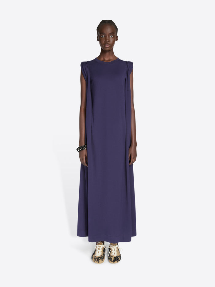 Model wearing a long dark blue dress on a white background - Dries Van Noten