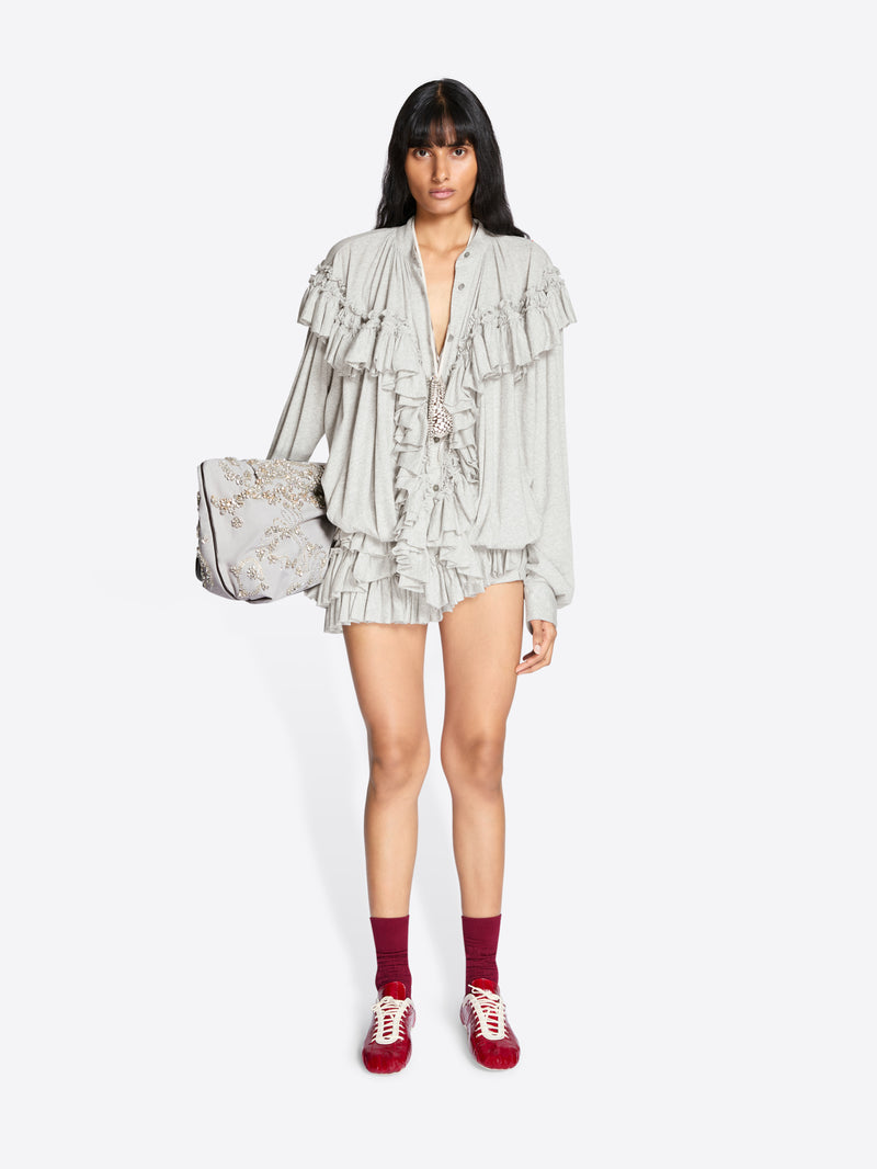 Woman wearing a ruffled outfit with a white background - Dries Van Noten