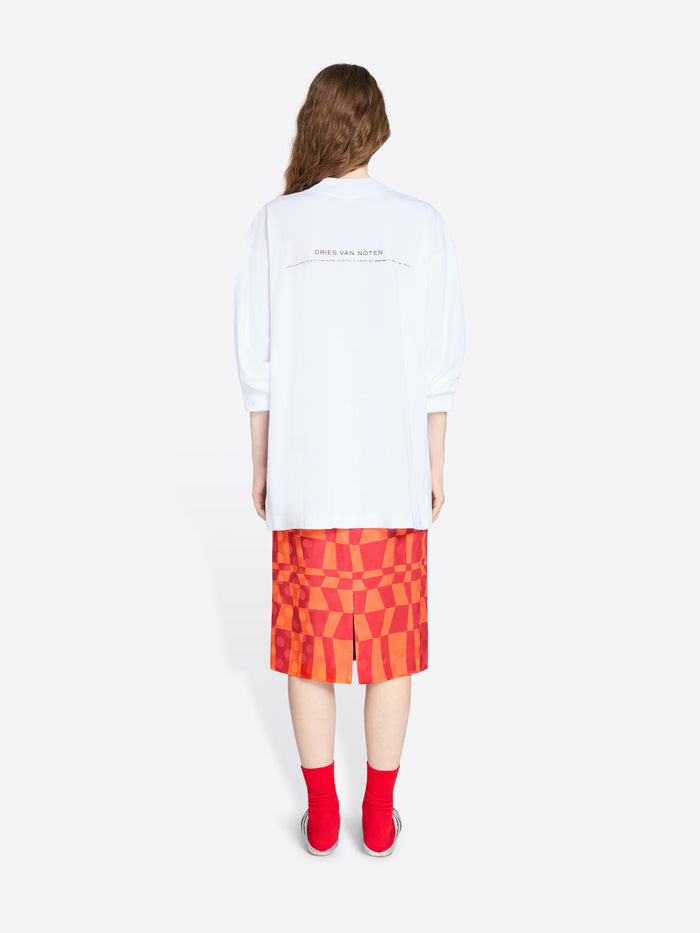 Person wearing a white t-shirt and a red checkered skirt on a white background - Dries Van Noten