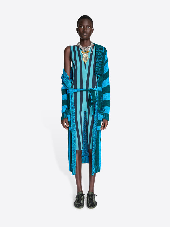 Model wearing a blue and green striped cardigan with a belt on a white background - Dries Van Noten