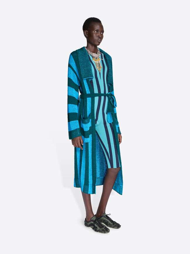 Model wearing a blue and green striped cardigan on a white background - Dries Van Noten
