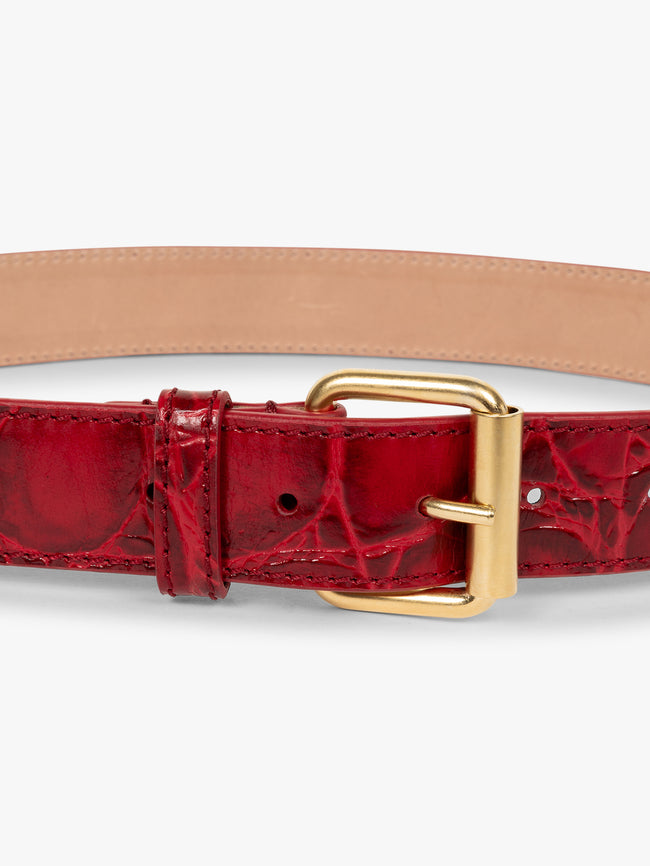 Red belt with gold buckle on a white background - Dries Van Noten
