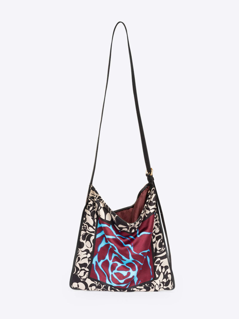 Multicolored bag with floral and animal print patterns on a white background - Dries Van Noten