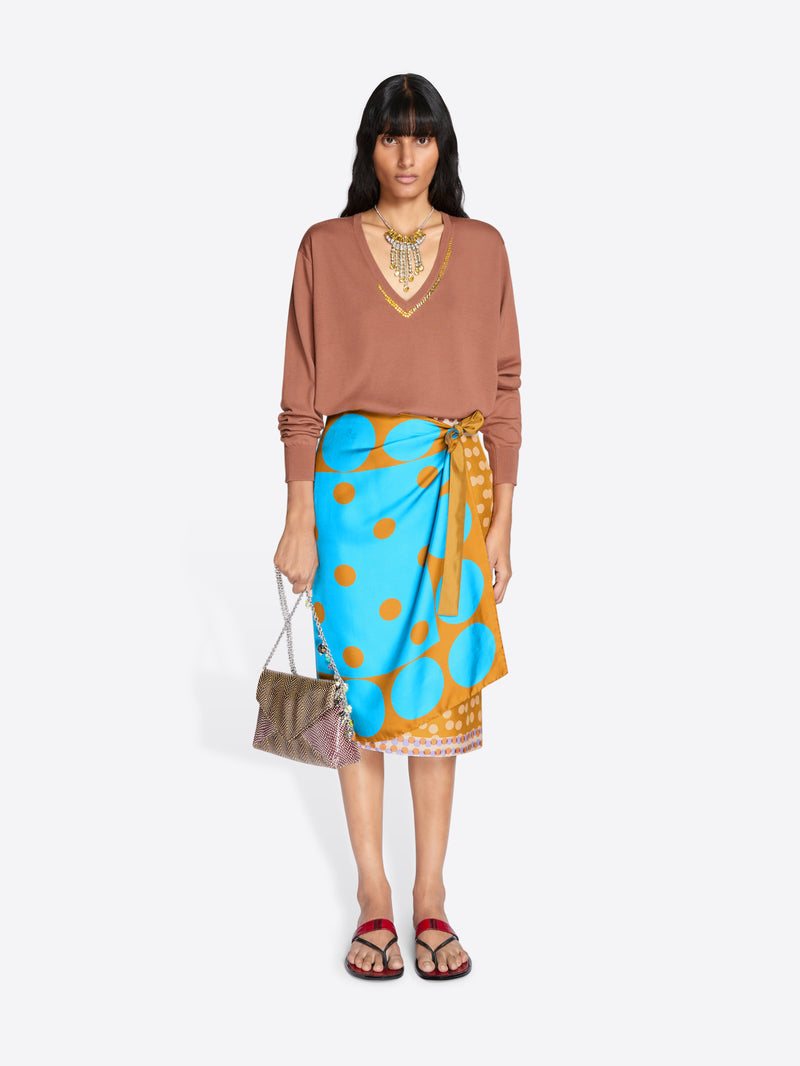 Woman wearing a brown top and colorful skirt with a white background - Dries Van Noten