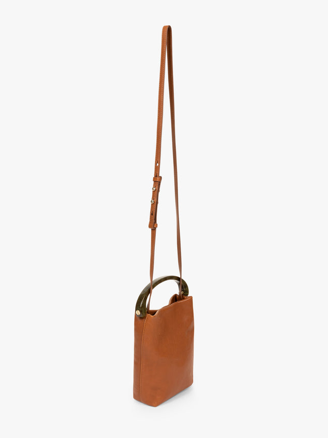 Brown leather handbag with a strap on a white background - Dries Van Noten