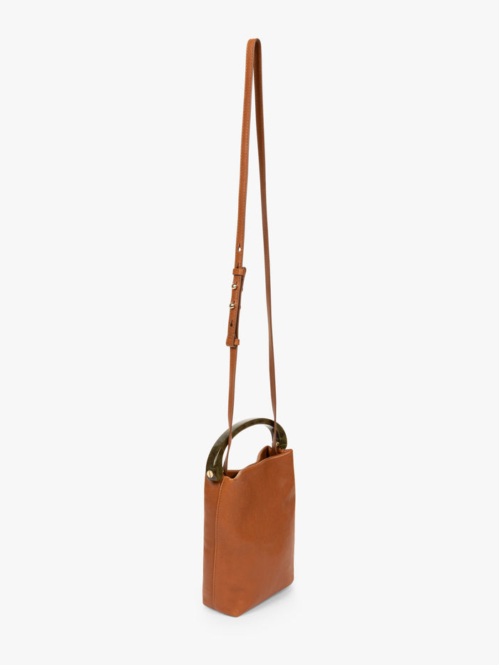 Brown leather handbag with a strap on a white background - Dries Van Noten