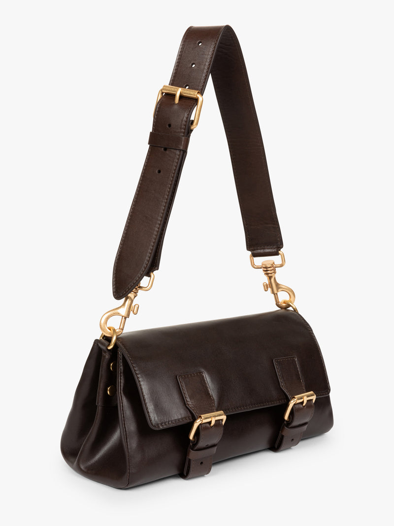 Brown leather handbag with gold hardware on a white background - Dries Van Noten