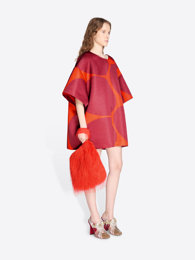 Model wearing a red and orange dress with a matching shawl on a white background - Dries Van Noten