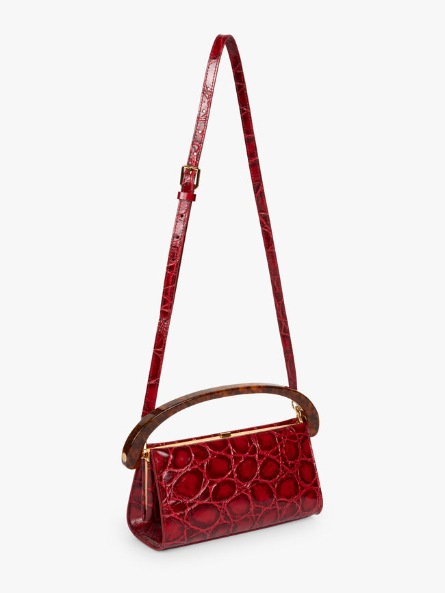Red handbag with a strap on a white background - Dries Van Noten