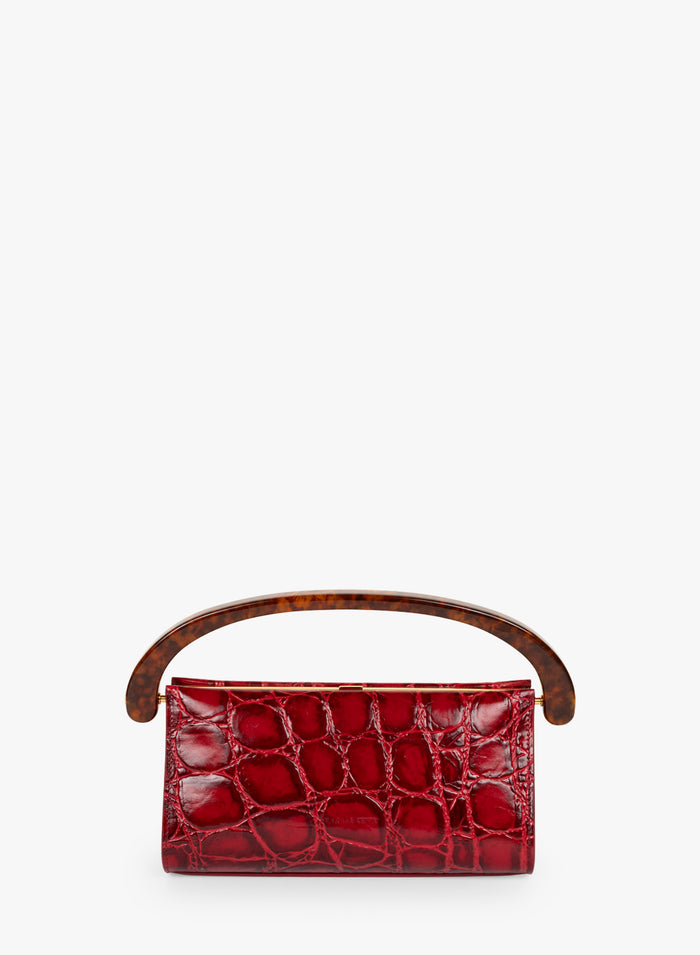Red handbag with a brown handle on a white background - Dries Van Noten