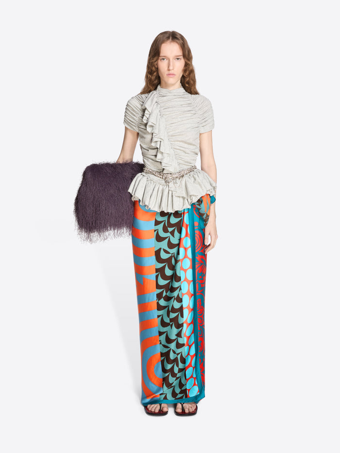 Woman wearing a patterned outfit with a white background - Dries Van Noten