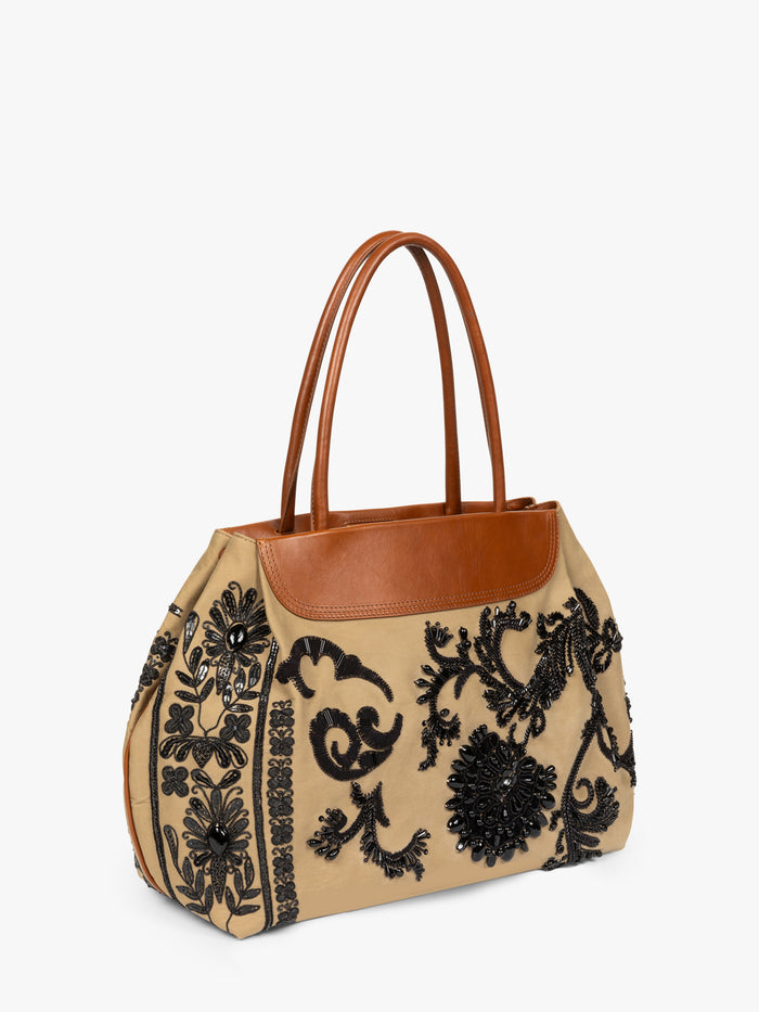 Beige handbag with black floral embroidery and brown leather accents on a white background - Dries Van Noten
