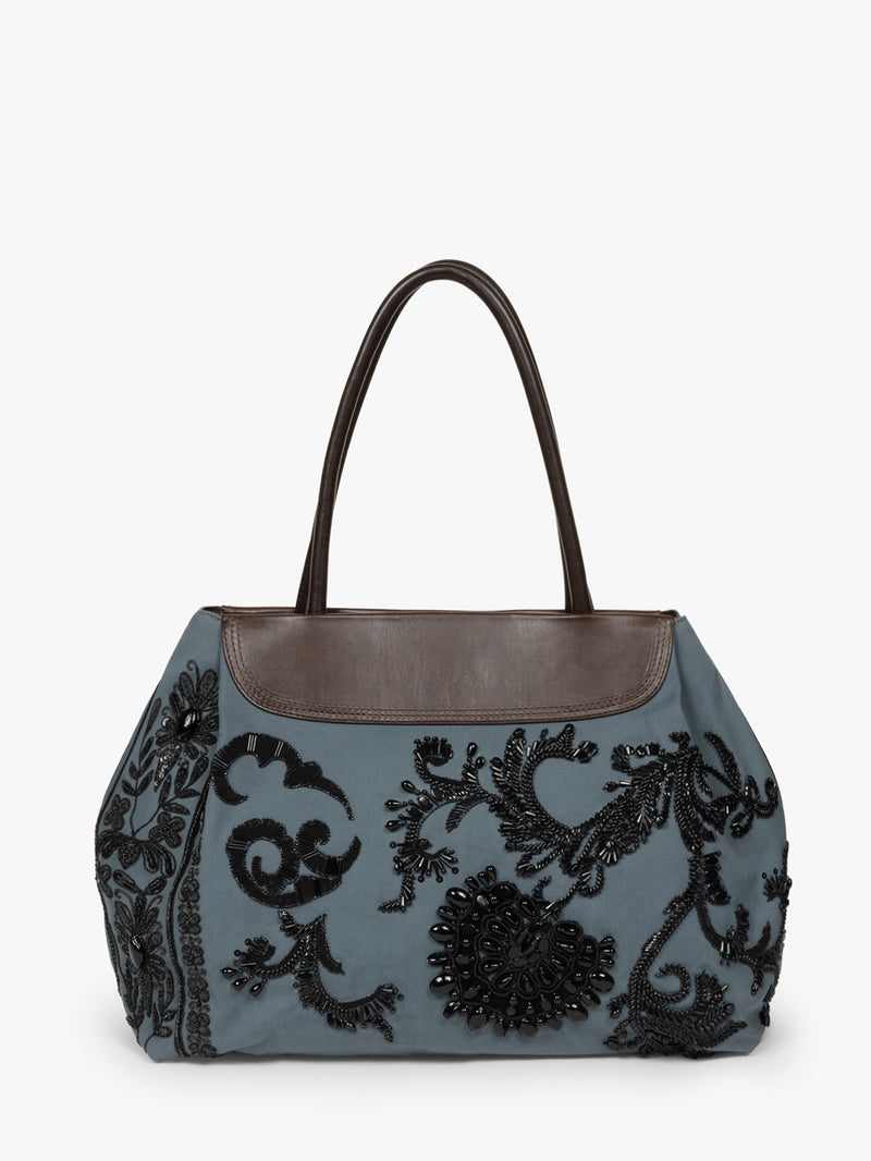 Gray handbag with black floral embroidery on a white background
