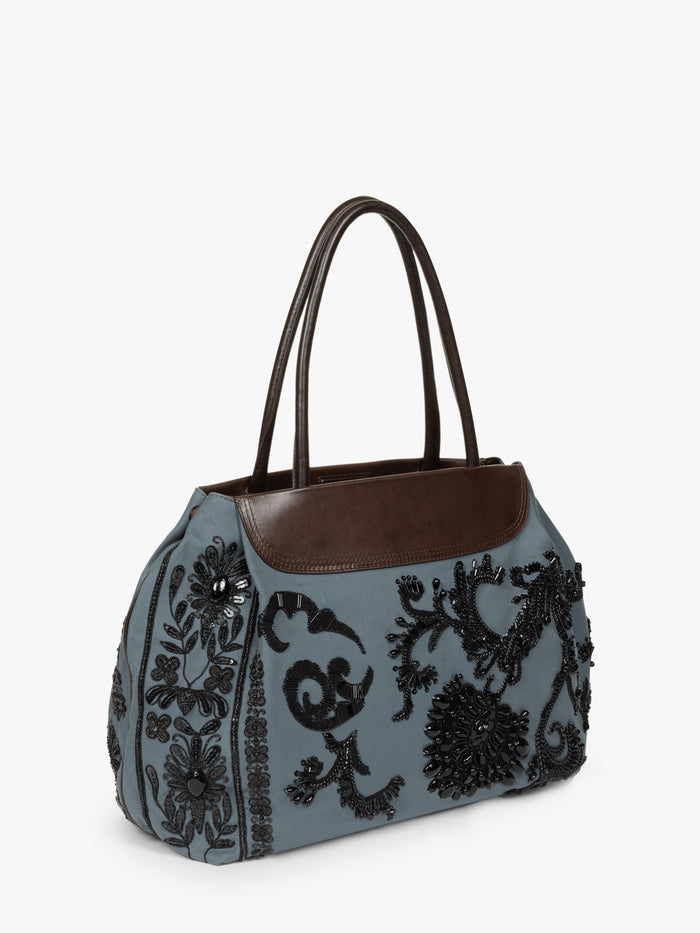 Gray handbag with black floral embroidery and brown leather accents on a white background - Dries Van Noten