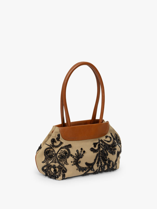 Handbag with black floral embroidery and brown leather accents on a white background - Dries Van Noten