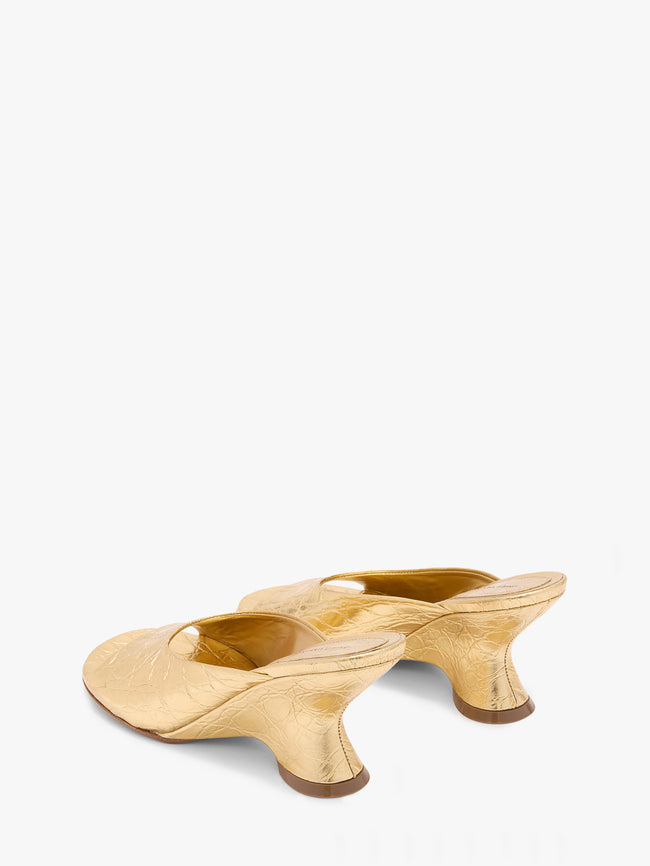 Pair of beige high-heeled shoes on a white background