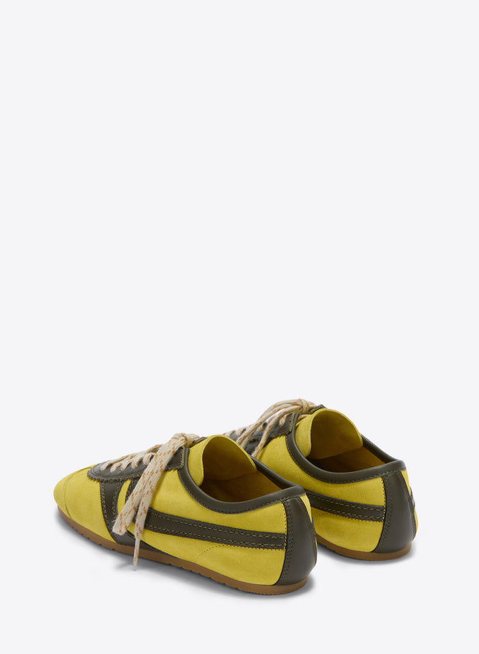 Pair of yellow and brown shoes on a white background