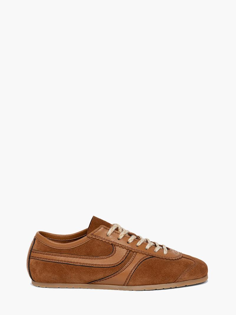 Brown sneaker with white laces on a white background