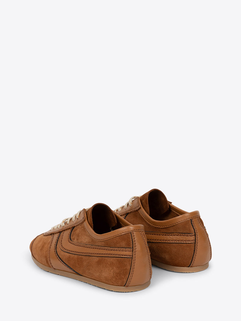 Pair of brown suede shoes on a white background