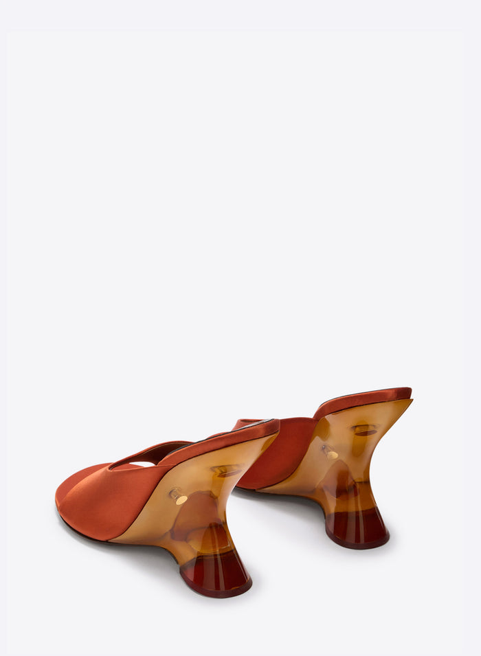 Pair of orange high-heeled shoes with transparent heel on a white background - Dries Van Noten