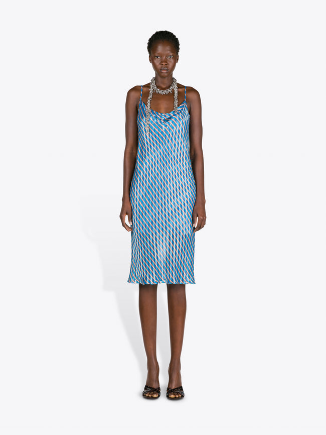 Woman wearing a blue patterned dress on a white background - Dries Van Noten