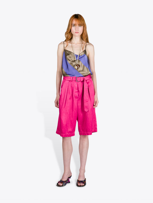 Woman wearing a colorful top and pink shorts on a white background - Dries Van Noten